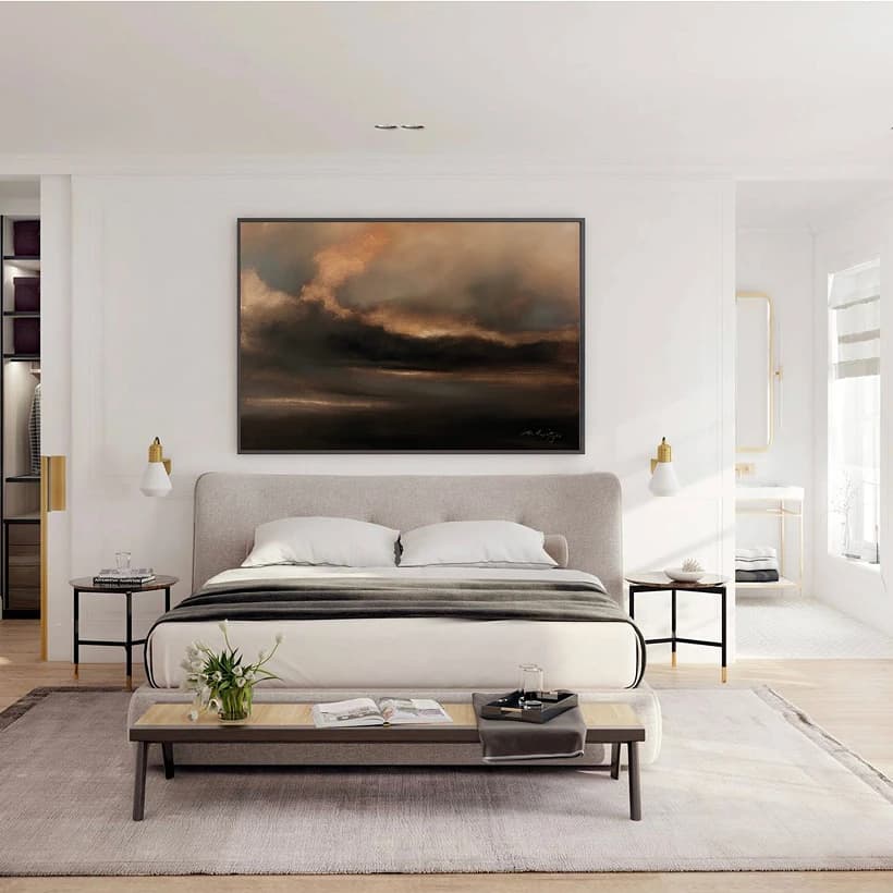 Dark atmospheric landscape painting displayed above a bed in a boutique hotel guest room